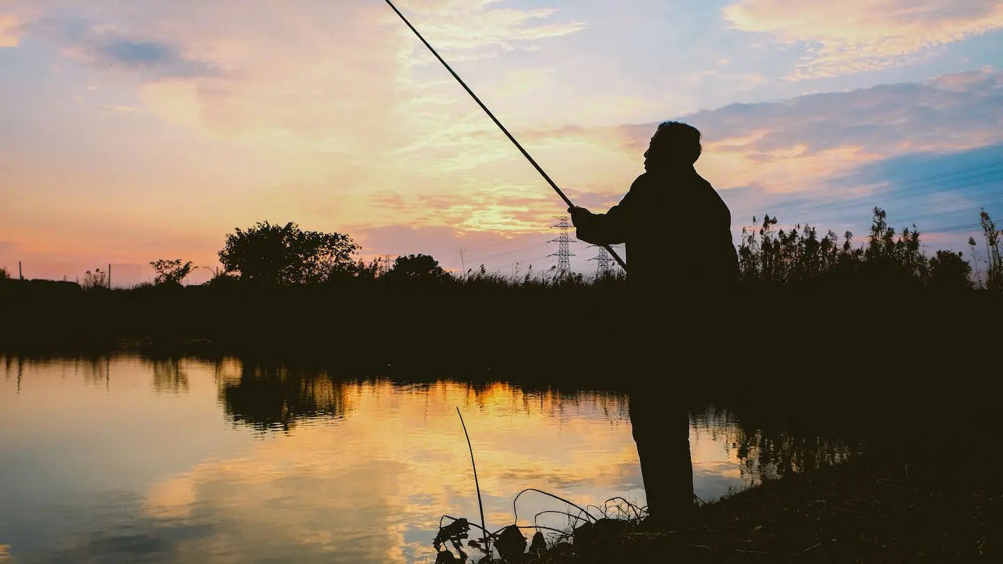 Older man fishing.
